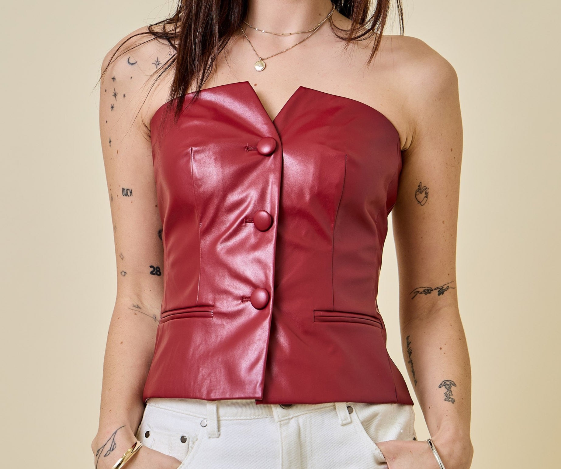 Sleeveless faux leather button down corset top