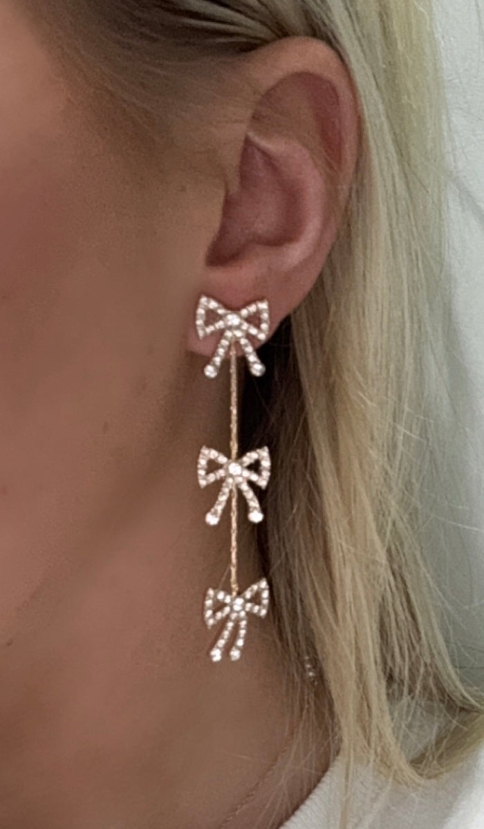 3 Crystal bows on a strand drop earrings