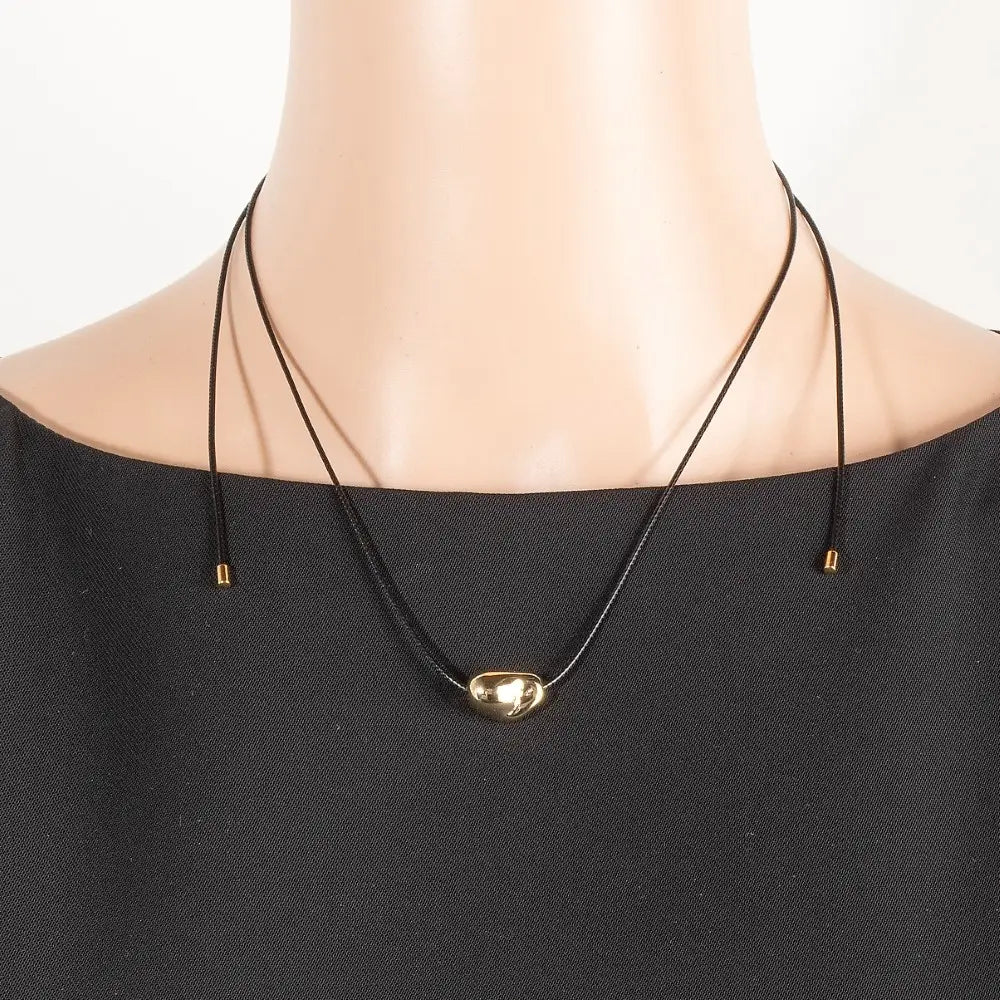 Metallic gold warped pendant adjustable cord necklace