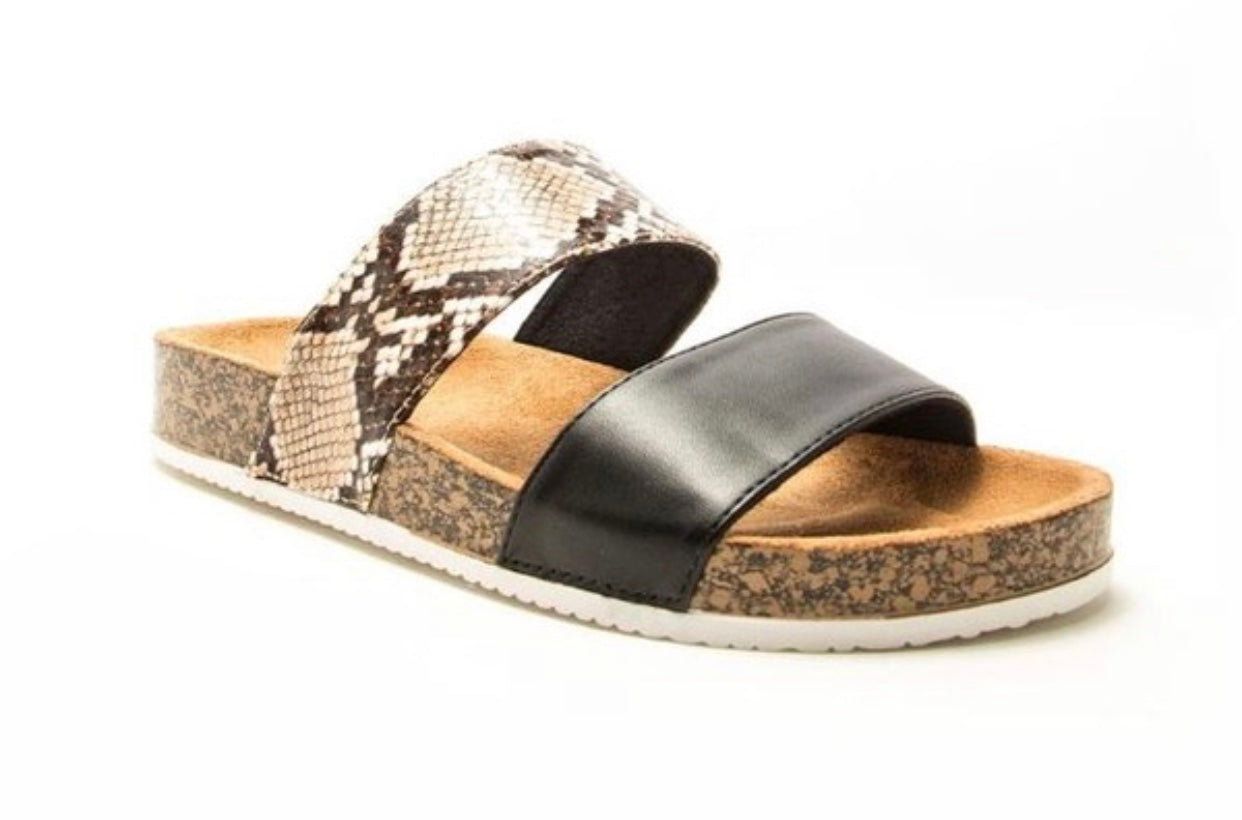 beige snake and black strap slides