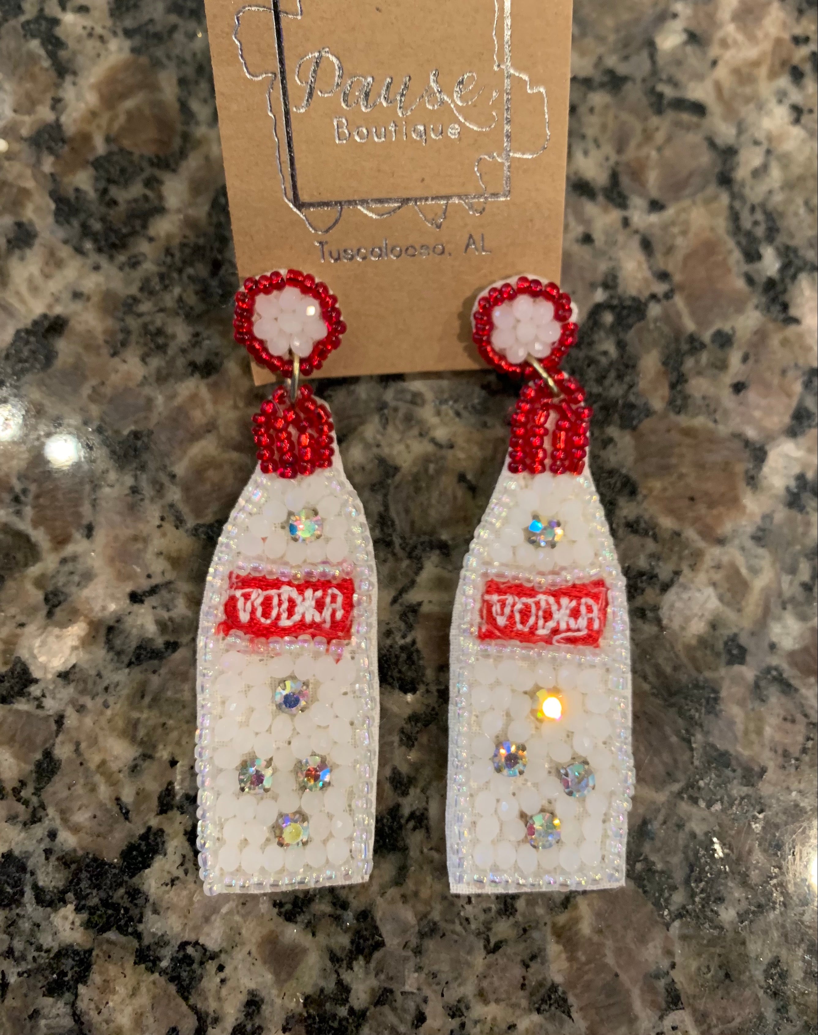 red and white beaded Vodka bottles