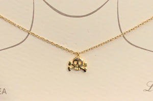 Tiny gold dipped skull & cross bones