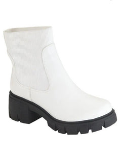 white boot with black bottom