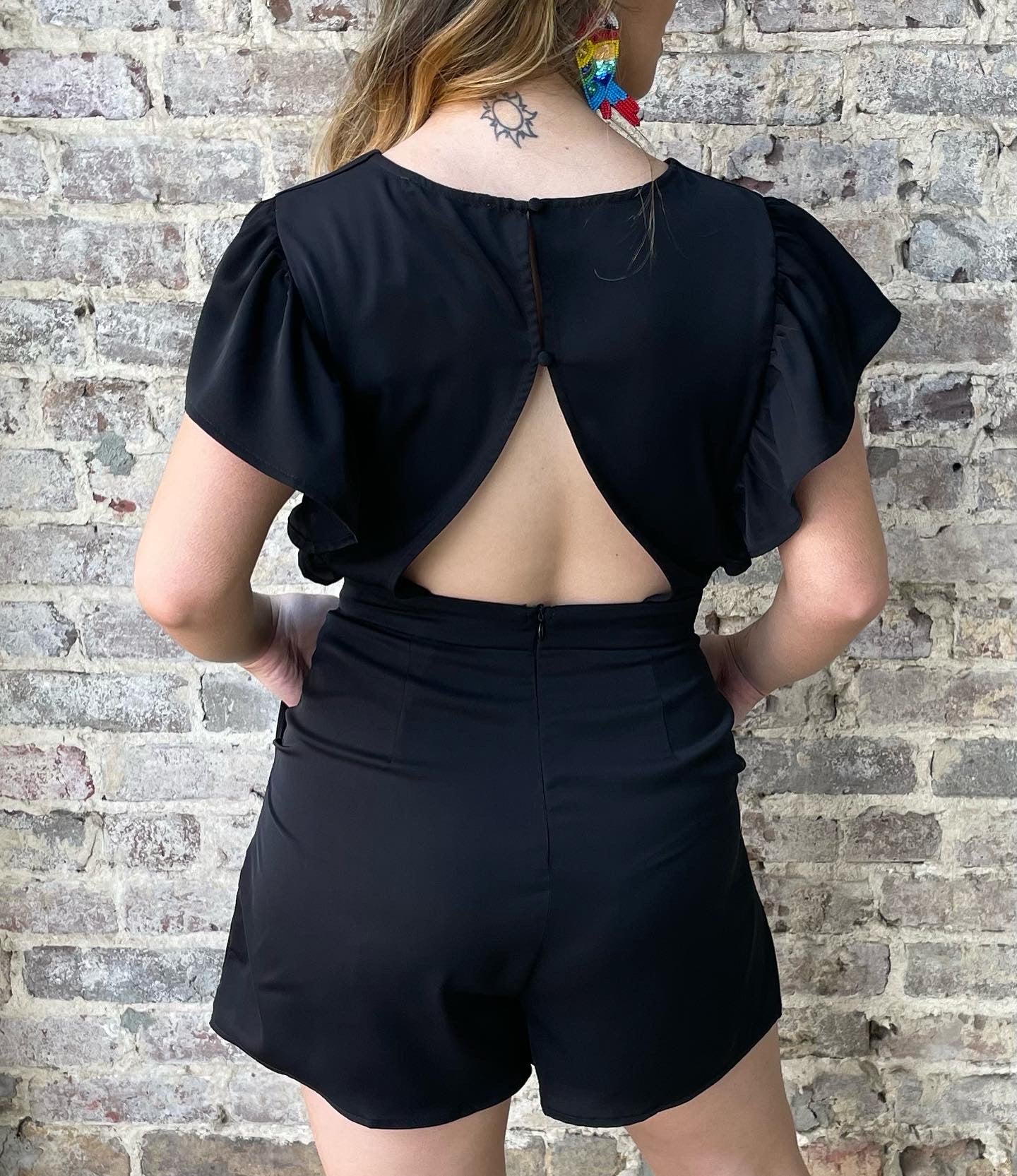 Ruffle romper with pockets