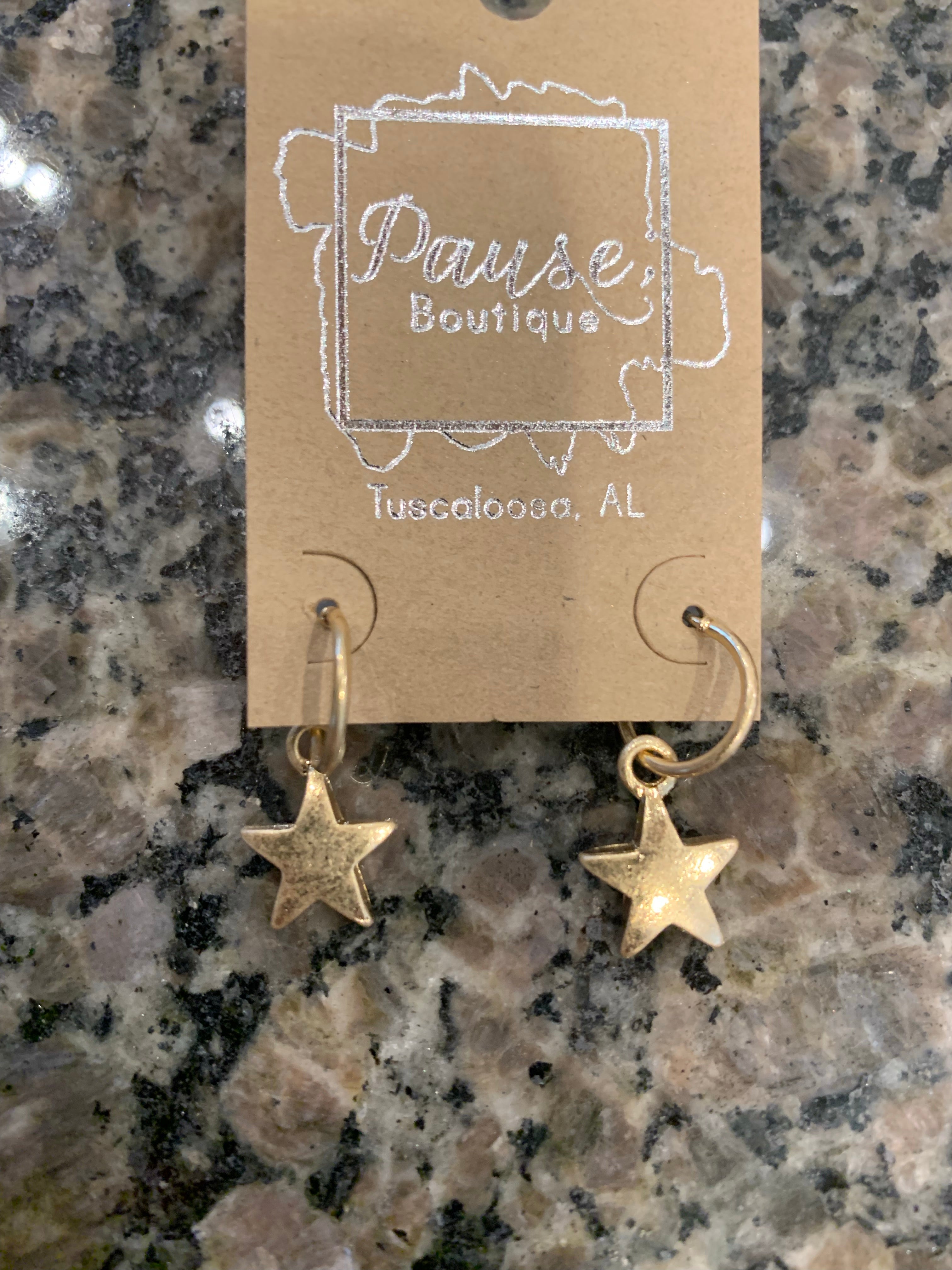 worn gold huggie star dangle